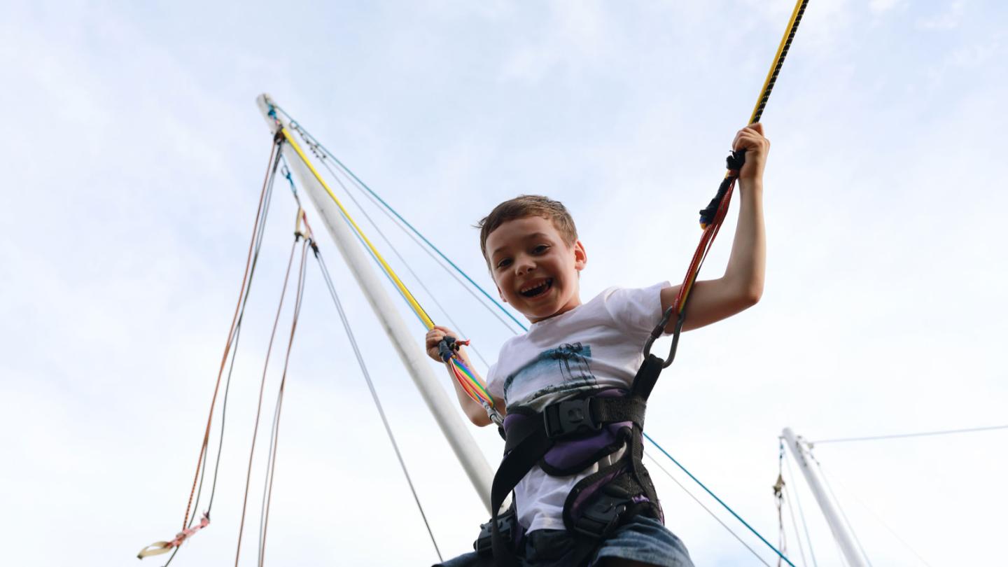 Child on the bungee trampoline at Crystal Mountain