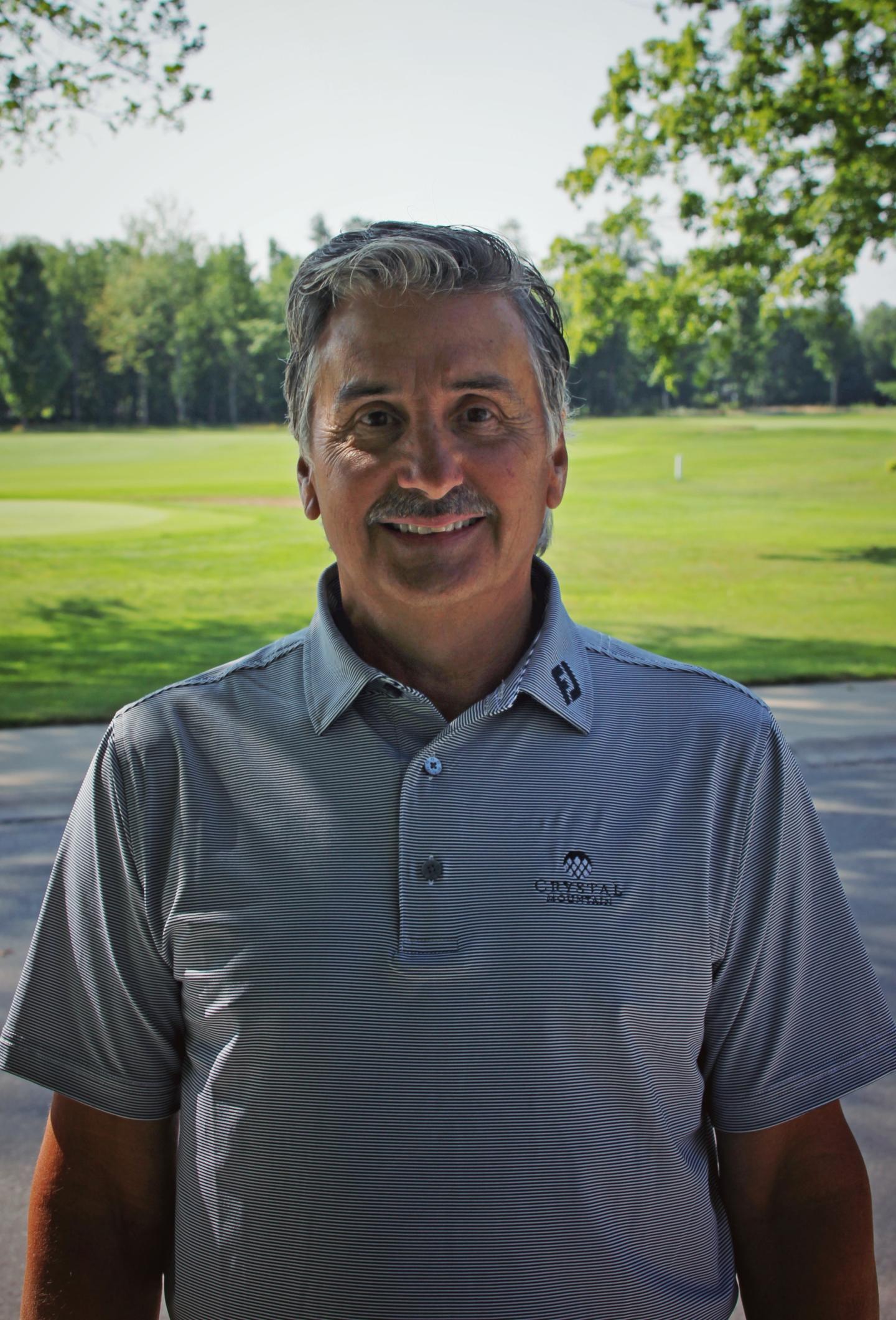 Mark Fenech, Director of Golf standing near Betsie Valley golf course.
