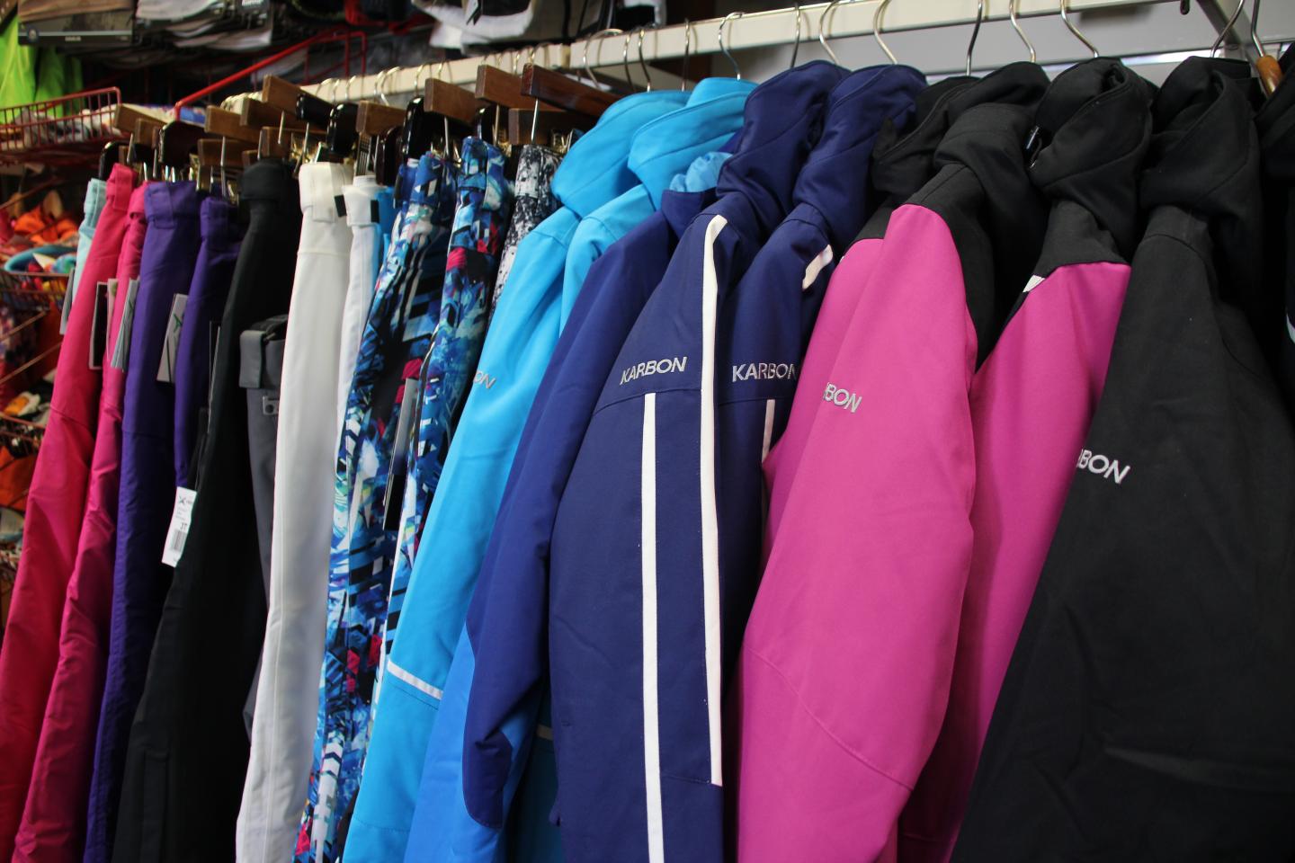 Jackets in various colors hanging on a rack.