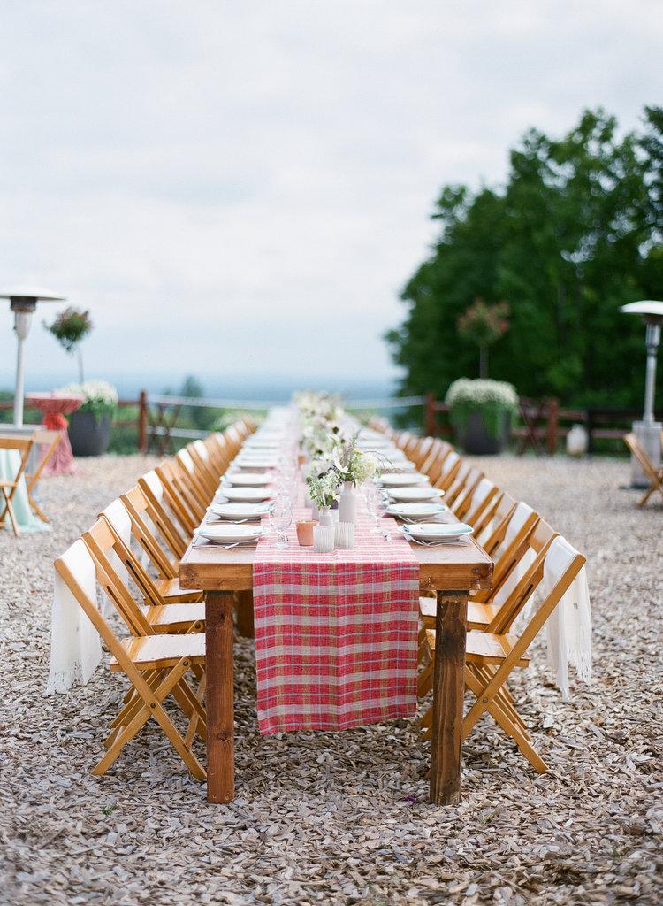Long banquet table on MountainTop for a family style rehearsal dinner.