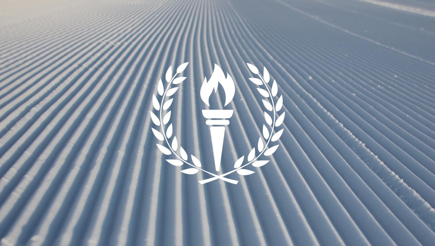 Torch and laurel graphic over a textured gray background.