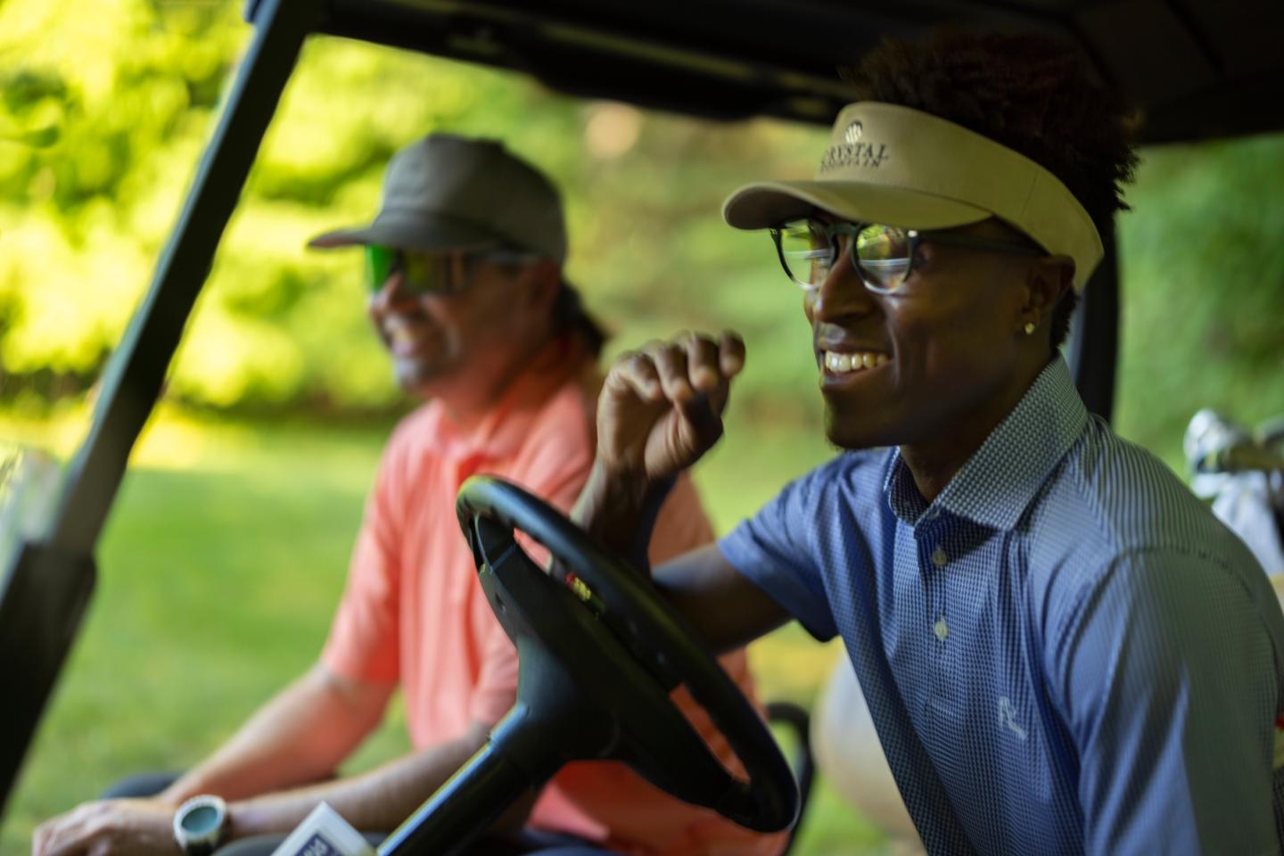 Sr. VP of Finance Everett Leonard, with professional golfer Joe Hooks